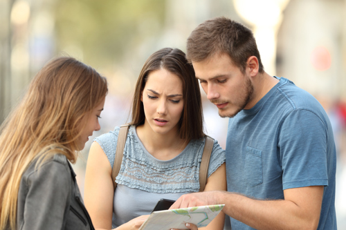 a group of friends looking at their device for translation
